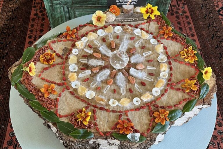 A mandala made of flowers and crystals in summery oranges and yellows