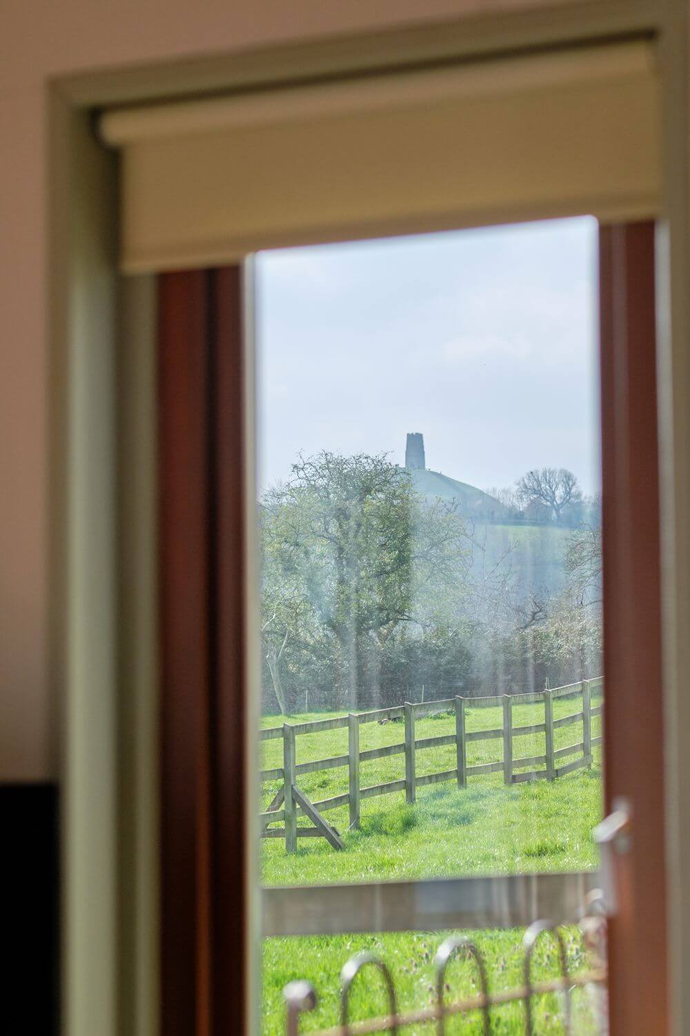 Glastonbury Tor viewed through on of our windows
